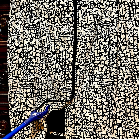 Lined skirt. Tan/Khaki with Black design. Back zipper. Back slit. - Picture 1 of 6